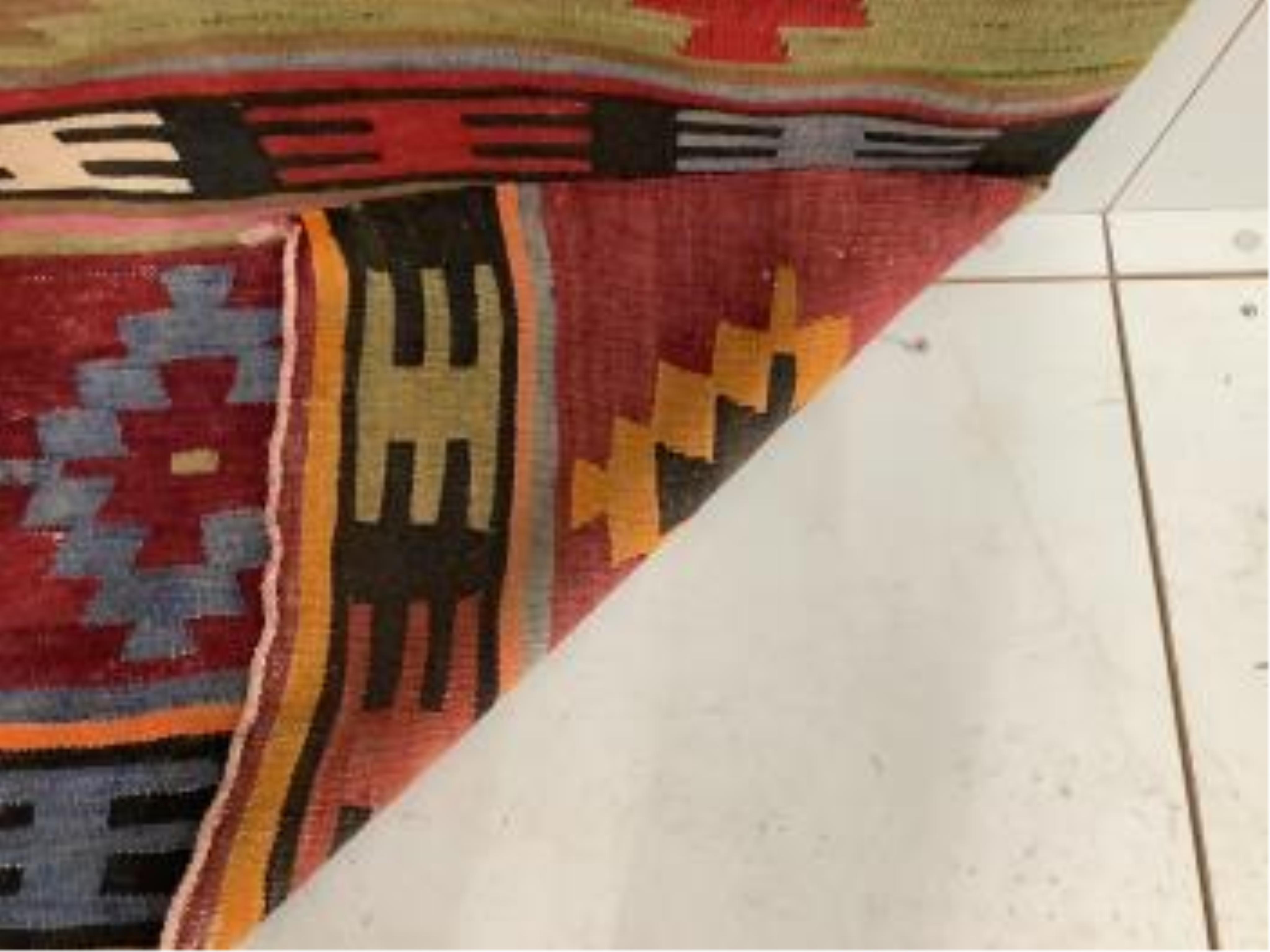 A Kilim polychrome flatweave rug, 280 x 140cm. Condition - fair